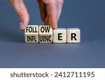 Small photo of Follower or influencer symbol. Concept words Follower Influencer on wooden cubes. Beautiful grey table grey background. Businessman hand. Business follower influencer concept. Copy space.