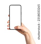 Small photo of Hand holding mobile phone, thumb clicking on blank screen mock-up, tapping ok on display, isolated on white background.
