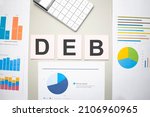 Small photo of DEB business, search engine optimazion,Text on the sheets of paper, charts and white calculator