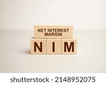 Small photo of NIM - Net Interest Margin acronym, business concept background