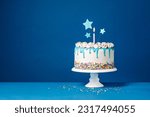 White birthday drip cake with...