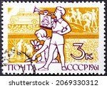 Small photo of A stamp printed in USSR. Boy with Clarion and girl, who planted plants without inscription, from the series International Children's Day , circa 1961