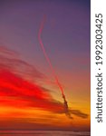 Small photo of Missile launch at sunset from Vandenberg Air Force Base viewed from Rincon beach