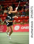 Small photo of Meghann Shaughnessy in action in the doubles vs Kirilenko/Hingis at Qatar Total Open, March 2, 2007.