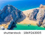 Small photo of Aerial view of Lovers Beach at Lands End, Cabo San Lucas, Mexico. The side facing the Sea of Cortez is named Lovers Beach while the side facing the Pacific Ocean is named Divorce Beach