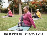Multiracial women doing yoga...