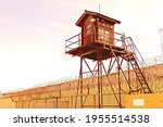 Prison Tower And Barbed Wire...