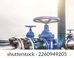Closing valve on water pump station is pipeline with tanks in an technical room for supply of high-pressure aqua. Water sprinkler pipes and pressure control industrial system. Copy text space