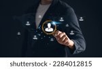 Small photo of Man holding magnifying glass with working man icon, representing the HR concept. Human resources, recruitment, job search and talent acquisition in focus.