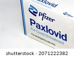 Small photo of New York, USA, November 2021: Pfizer Covid-19 Paxlovid treatment box isolated on a white background. Health and prevention.