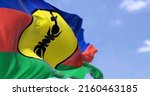 Small photo of The flag of New Caledonia waving in the wind on a clear day. New Caledonia is a sui generis collectivity of overseas France in the southwest Pacific Ocean