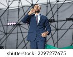 Small photo of The comedian Carlo Amleto, who participated in the television program Zelig 2022, performs at the concert during the labor day of May 1 in Taranto, Puglia 01.05.2023