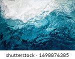 An abstract background of seawater flow under light exposure