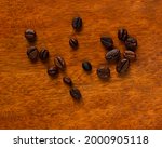 Coffee Beans On A Wooden...