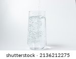 Drinking water is poured into a ...
