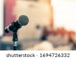 Small photo of Microphone voice speaker in business seminar, speech presentation, town hall meeting, lecture hall or conference room in corporate or community event for host or townhall public hearing
