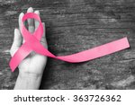 Pink ribbon for breast cancer awareness, symbolic bow color raising awareness on people living with women's breast tumor illness (bow isolated with clipping path)