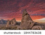 Beautiful sunset with colorful orange and purple clouds setting over the natural rock formations of City Of Rocks National Reserve, in Southern Idaho, no people, large jpeg