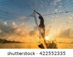 Fisherman Throwing Fishing Net...