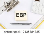 Small photo of EBP Evidence-based practice - business concept, message on the sticker on a folder background with calculator