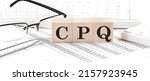 Small photo of CPQ Configure Price Quote written on a wooden cube with keyboard , calculator, chart,glasses.Business concept