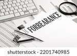 Small photo of FORBEARANCE text on a paper with chart and keyboard, business concept