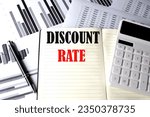 DISCOUNT RATE text written on notebook on chart and diagram