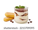Jar with layered tiramisu cake and savoyardy cookies on white