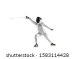 Small photo of Teen girl in fencing costume with sword in hand isolated on white studio background. Young female caucasian model practicing and training in motion, action. Copyspace. Sport, youth, healthy lifestyle.