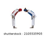 Small photo of Korean martial arts. Studio shot of two young women, taekwondo athletes greeting each other isolated over dark background. Challenges. Concept of sport, education, skills, workout, health