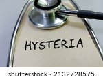 Small photo of Hysteria text with sthethoscope. Word Hysteria. Concept Image. Hysteria Syndrome.