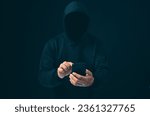 Small photo of Hackers work on phone in the dark. The concept of information security in the Internet network and information espionage. Virus attack. Hacker attack.