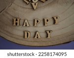 Banner. The word Happy Day. Love on wooden blocks. Theme of love. Wooden letter blocks. Loving, positive emotions