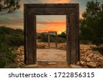 Small photo of The gates of Llentia at dawn in Ibiza, Spain