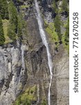 Small photo of Steep waterfall in the Swiss mountains - Rosenlaui Valley, Bernese Oberland region, Switzerland