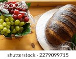 Small photo of first holy communion bread and grapes. first holy communion decorations. first holy communion sacrifices on the altar. Sacred items bread and grapes for wine. Bread for christianity.