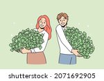 happy people hold piles of... | Shutterstock .eps vector #2071692905
