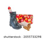 Small photo of jute bags of gingerbread cookies with a pete hat. Sinterklaas in the Netherlands and Belgium, is celebrated every year on December 5. Children can put their shoe for a gift and receive gingerbread coo