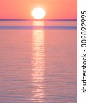 Small photo of shape reflection sea. Sun reflection on the sea in a normal and foregone sunset