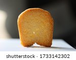 Small photo of Miniature uneaten bread with a shadow being cast