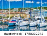 Croatia, beautiful city of Rijeka, yachts and sailboats in marina, seascape and skyline in background
