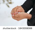 Hands Holding Snow  Making...