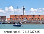 Small photo of Calais, France - June 22 2020: The Calais Lighthouse (French: Phare de Calais) is a 51m lighthouse built in 1848 with a museum and 271 steps to climb for views of the port and coast.