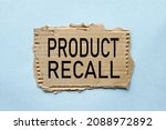 Small photo of product recal. text on on torn paper. blue background