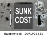 Sunk Cost. On Desktop Gray...