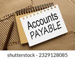 Small photo of Accounts Payable word per page on a craft notepad