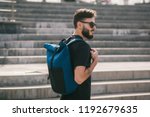 Male wearing sunglasses model backpackers travel summer traveler holidays in the city.