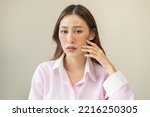 Dermatology, expression face worry, stressed asian young woman hand touching facial at dark spot of melasma, freckles from pigment melanin, allergy sun. Beauty care, skin problem treatment, skincare.