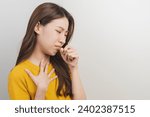 Small photo of Female unhealthy Sickness, asian young woman, girl unwell and coughing, have cold, sore throat isolated white background suffering with symptom cough feeling bad. Healthcare of Coronavirus, covid-19.