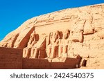 Small photo of Abu Simbel, the Great Temple of Ramesses II, carved into the rock. Nubia, Egypt - October 19, 2023.